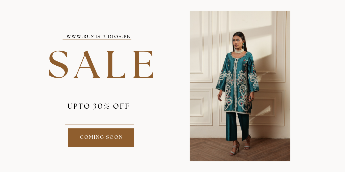 Woman in a teal embroidered outfit with a sale banner on a white background